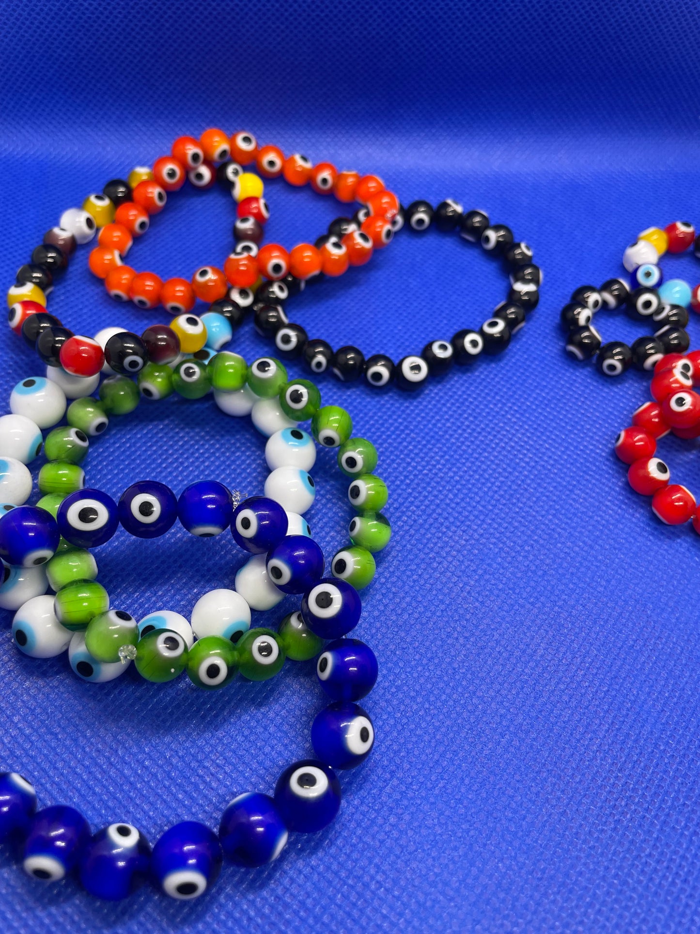 Evil eye beaded bracelets & rings