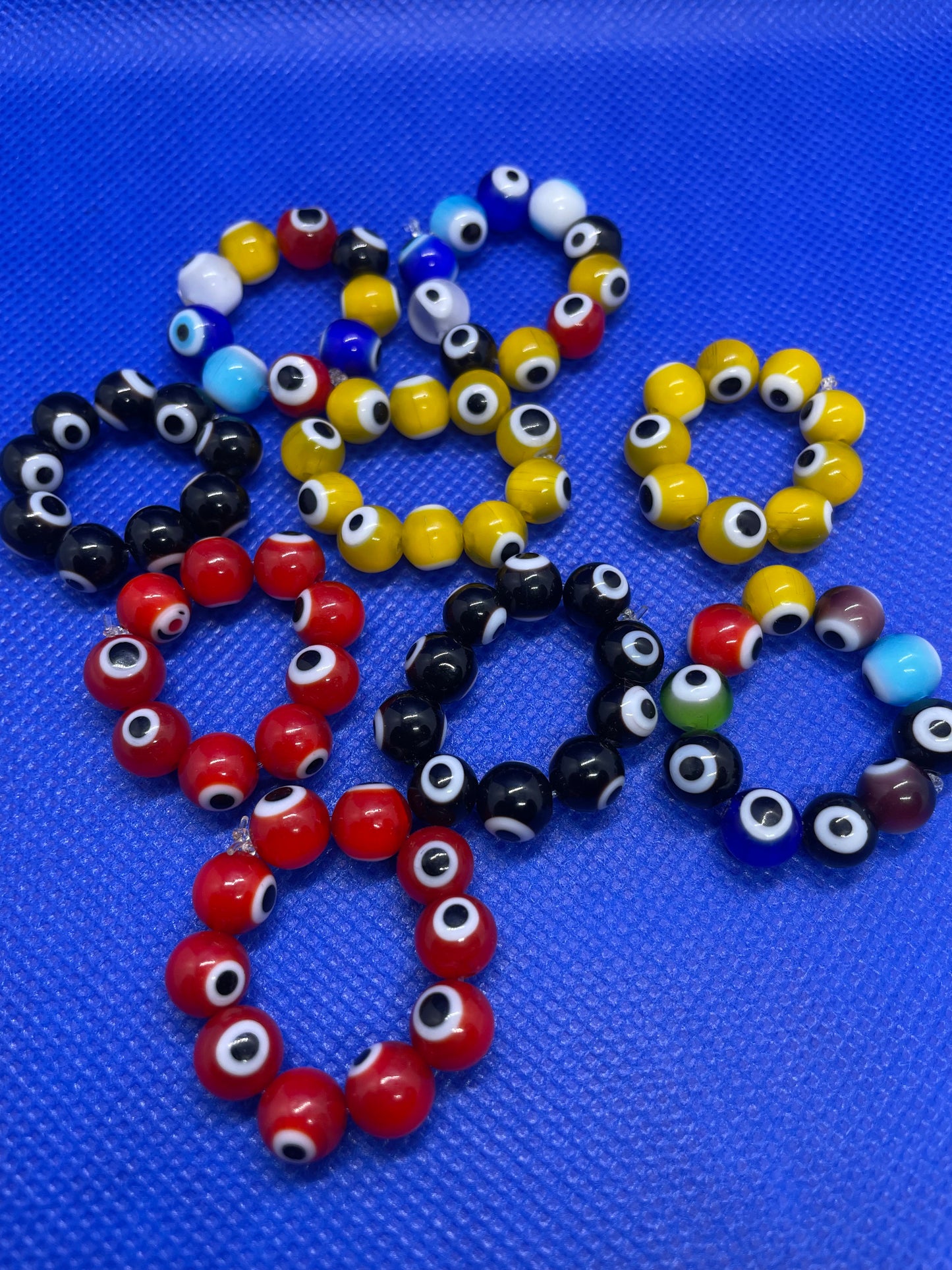 Evil eye beaded bracelets & rings
